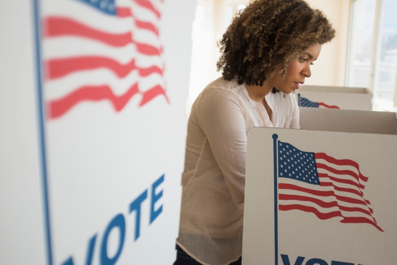 Woman at voting booth