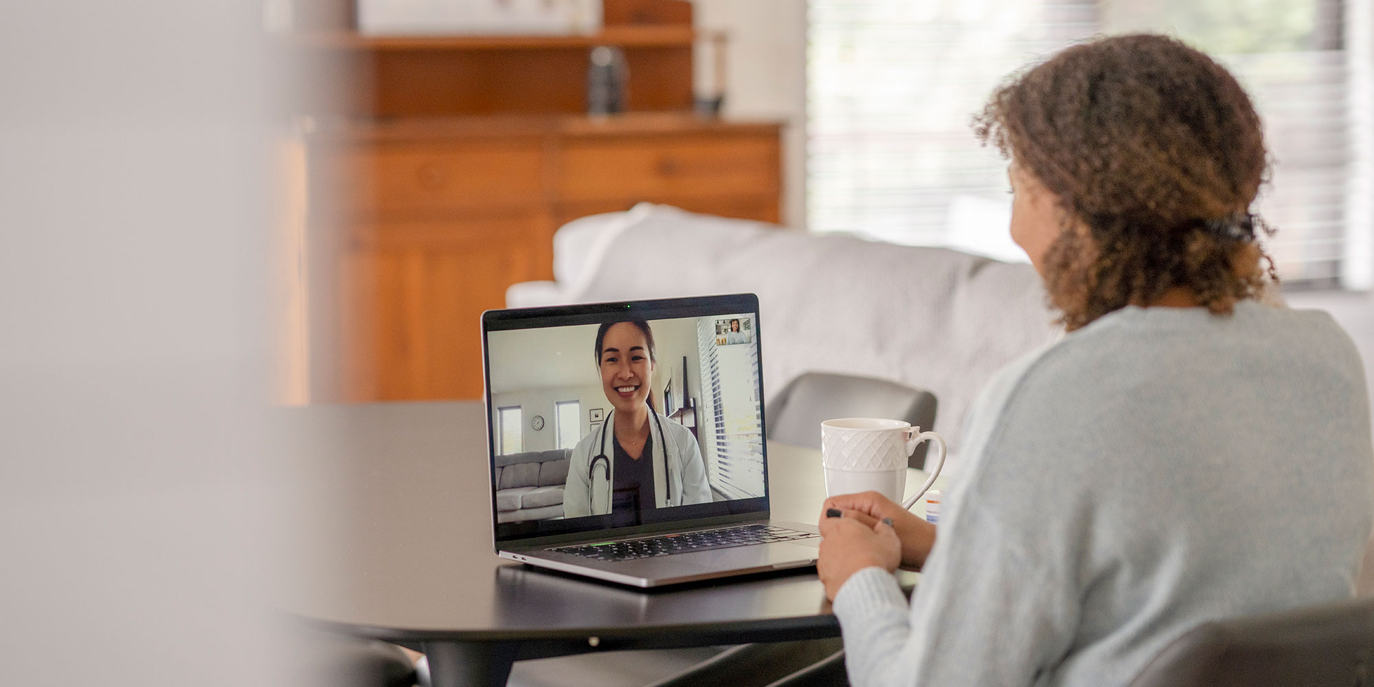 patient on computer for virtual appointment