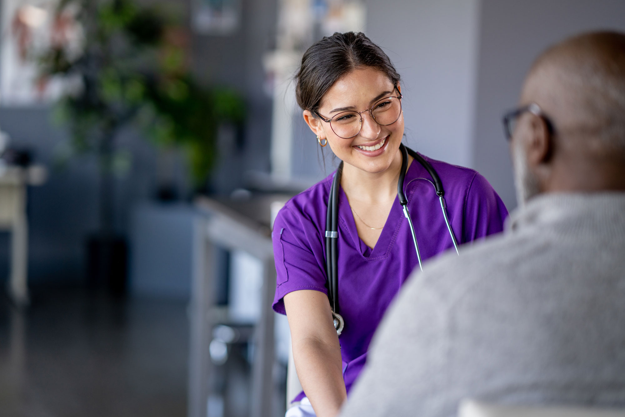 Provider in purple scrubs